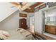 Bedroom with a ceiling fan, decorative ceiling, and bathroom entrance at 202 Laurel Oaks Rd, Nokomis, FL 34275