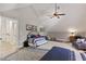 Spacious bedroom features vaulted ceilings, two beds, and a cozy seating area at 202 Laurel Oaks Rd, Nokomis, FL 34275