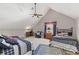 Cozy bedroom with vaulted ceilings, two beds and comfortable seating area at 202 Laurel Oaks Rd, Nokomis, FL 34275
