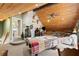 Large game room with vaulted wood ceilings, pool table, and unique decor at 202 Laurel Oaks Rd, Nokomis, FL 34275