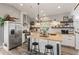 Modern kitchen features a butcher block island, stainless steel appliances, and stylish open shelving at 202 Laurel Oaks Rd, Nokomis, FL 34275