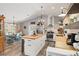 Spacious kitchen featuring a butcher block island and stainless appliances adjacent to the dining area at 202 Laurel Oaks Rd, Nokomis, FL 34275