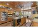 Open kitchen with island and stainless steel appliances at 202 Laurel Oaks Rd, Nokomis, FL 34275