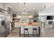 Bright kitchen with a butcher block island, modern appliances, and a view into an adjacent living area at 202 Laurel Oaks Rd, Nokomis, FL 34275