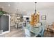 View of kitchen and dining areas showcasing butcher block island, stainless appliances, and dining table at 202 Laurel Oaks Rd, Nokomis, FL 34275