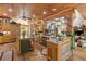 Large kitchen with wood cabinets and rustic decor at 202 Laurel Oaks Rd, Nokomis, FL 34275