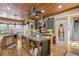 Spacious kitchen with a large island, wooden cabinets, and plenty of room for cooking and entertaining at 202 Laurel Oaks Rd, Nokomis, FL 34275