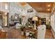 Cozy living room with stone fireplace and high vaulted ceilings and hardwood floors at 202 Laurel Oaks Rd, Nokomis, FL 34275