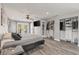 Bright main bedroom offers wood-look floors, ceiling fan, closet and access to the outdoors at 202 Laurel Oaks Rd, Nokomis, FL 34275