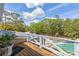 Beautiful aerial view of a serene pool with lush trees surrounding the home at 202 Laurel Oaks Rd, Nokomis, FL 34275