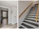 The staircase features unique patterned tile risers and a wood handrail at 202 Laurel Oaks Rd, Nokomis, FL 34275