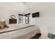 Bright bedroom with a ceiling fan, television, and windows with treatments at 226 Southampton Ln # 257, Venice, FL 34293