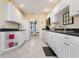 Bright kitchen with white cabinets, and easy access to the dining area at 226 Southampton Ln # 257, Venice, FL 34293