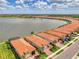 Aerial shot showing the home's location on a waterfront property with stunning lake views at 24128 Spartina Dr, Venice, FL 34293