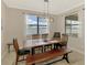 Dining room with bench seating, two windows and natural light with scenic views at 24128 Spartina Dr, Venice, FL 34293