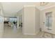 Bright foyer with tiled floor and view into the living room at 24128 Spartina Dr, Venice, FL 34293