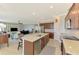 Open kitchen with stainless appliances, breakfast bar and view of the Gathering room at 24128 Spartina Dr, Venice, FL 34293