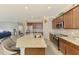 Open kitchen with stainless appliances, granite counters, breakfast bar and view of the Gathering room at 24128 Spartina Dr, Venice, FL 34293