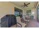 Covered lanai with seating, grill, and beautiful water views at 24128 Spartina Dr, Venice, FL 34293