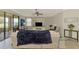 Spacious living room with ceiling fan, water view, and neutral decor at 24128 Spartina Dr, Venice, FL 34293