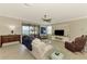Comfortable living room with ceiling fan, water view, and modern furnishings at 24128 Spartina Dr, Venice, FL 34293