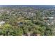 A high aerial view of a local park showing a walking bridge and water feature with mature trees at 2641 Hyde Park St, Sarasota, FL 34239