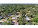 A high aerial view of a suburban neighborhood surrounded by lush landscaping and mature trees at 2641 Hyde Park St, Sarasota, FL 34239