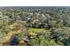 A high aerial view of a local park showing a walking bridge and water feature with mature trees at 2641 Hyde Park St, Sarasota, FL 34239