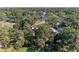 Aerial view of a neighborhood highlighting lush greenery and tree-lined streets at 2641 Hyde Park St, Sarasota, FL 34239