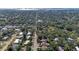 A high aerial view looking down a neighborhood street with well maintained homes and mature trees at 2641 Hyde Park St, Sarasota, FL 34239