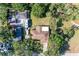 An aerial view looking directly down at a well maintained home, landscaped yard and neighboring trees at 2641 Hyde Park St, Sarasota, FL 34239