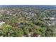 A high aerial view of a local park showing a walking bridge and water feature with mature trees at 2641 Hyde Park St, Sarasota, FL 34239