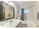 Bathroom with sink, mirror, toilet, and bathtub at 2641 Hyde Park St, Sarasota, FL 34239