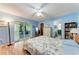 The primary bedroom offers access to a screened-in patio and an ensuite bathroom at 2641 Hyde Park St, Sarasota, FL 34239