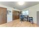 Bedroom featuring wood floors, two-door closet, and desk with a printer at 2641 Hyde Park St, Sarasota, FL 34239