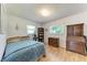 Cozy bedroom featuring a bed, dresser, bookcase, and window at 2641 Hyde Park St, Sarasota, FL 34239