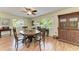 The dining room features a dining table and antique cabinet with window views at 2641 Hyde Park St, Sarasota, FL 34239