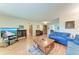 Open living room features wood floors and comfortable blue sofas at 2641 Hyde Park St, Sarasota, FL 34239