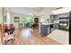 Open living space with laminate floors seamlessly connecting a living room and dining area at 2641 Hyde Park St, Sarasota, FL 34239