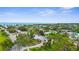 Coastal community featuring homes nestled among lush trees with ocean views at 304 Beach Rd, Venice, FL 34285