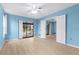 Bedroom features a ceiling fan, double doors to another room, and glass sliding doors to the backyard at 304 Beach Rd, Venice, FL 34285