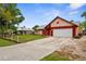 Attractive single-story home with a spacious driveway, attached two-car garage, and manicured landscaping at 304 Beach Rd, Venice, FL 34285