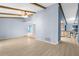 Inviting living area showcasing an open layout, wood-look tile flooring, and seamless flow to the kitchen at 304 Beach Rd, Venice, FL 34285