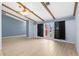 Spacious living room with beamed ceilings, wood-look tile floors, and neutral wall color at 304 Beach Rd, Venice, FL 34285