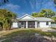 The back exterior features a screened lanai and an inviting outdoor space perfect for relaxation at 3192 Pinetree St, Port Charlotte, FL 33952