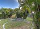 Expansive backyard with well-maintained lawn and mature landscaping at 3192 Pinetree St, Port Charlotte, FL 33952