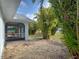 Beautifully landscaped backyard with screened lanai, perfect for outdoor entertaining at 3192 Pinetree St, Port Charlotte, FL 33952