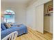 Sunlit bedroom featuring a closet with double doors at 3192 Pinetree St, Port Charlotte, FL 33952