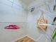 Walk-in closet featuring white wire shelving and wood-look flooring at 3192 Pinetree St, Port Charlotte, FL 33952