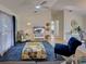 Comfortable living room with vaulted ceiling, modern furnishings, and light hardwood flooring at 3192 Pinetree St, Port Charlotte, FL 33952